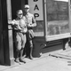 Two American Nazis in uniform stand in the doorway of their newly opened headquarters in the Yorkville section of New York City on April 1, 1932.